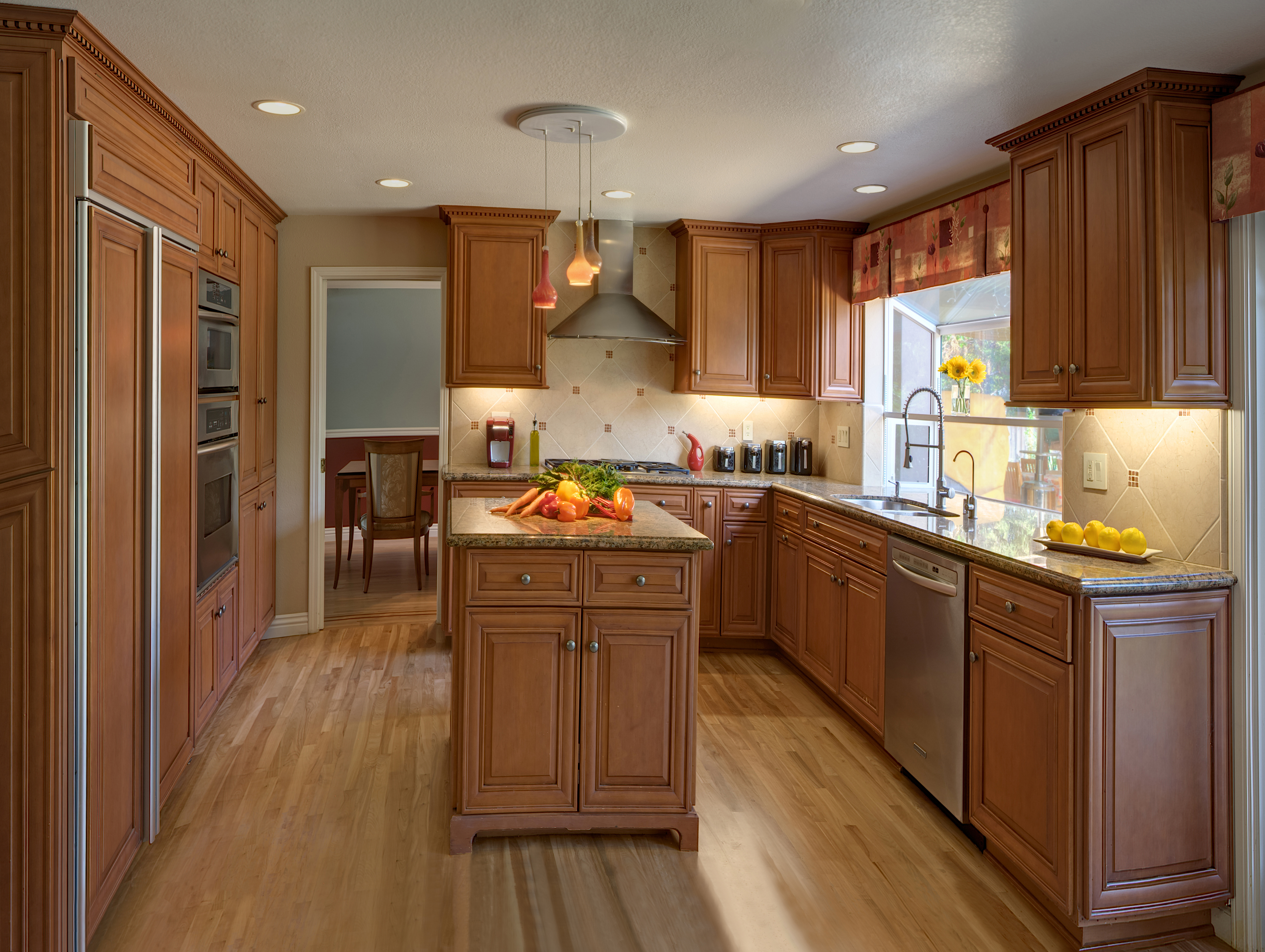 Saratoga kitchen is redesigned with new custom cabinets, counters, lighting, flooring and window coverings.